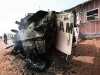 Nigerian wheeled armoured personnel carrier Piranha I Grizzly picture. An African Union Mission in the Sudan (AMIS) peacekeeper from Nigeria points to the blast point of a rocket-propelled grenade on a destroyed armoured personnel carrier at Haskanita military group site (MGS), October 1, 2007. Twenty AU soldiers were killed or injured and nine missing after a "deliberate and sustained" assault on the Haskanita base in Darfur on Saturday night by armed men in 30 vehicles, who looted and destroyed the base, the African Union said.