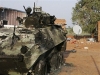 Nigerian wheeled armoured personnel carrier Piranha I Grizzly picture. An African Union Mission in the Sudan (AMIS) peacekeeper from Nigeria points to the blast point of a rocket-propelled grenade on a destroyed armoured personnel carrier at Haskanita military group site (MGS), October 1, 2007. Twenty AU soldiers were killed or injured and nine missing after a "deliberate and sustained" assault on the Haskanita base in Darfur on Saturday night by armed men in 30 vehicles, who looted and destroyed the base, the African Union said.