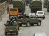 Georgian army light wheeled vehicle jeep picture. Military personnel patrol a street in central Tbilisi, November 8, 2007. A ring of soldiers cordoned off central Tbilisi on Thursday after Georgian President Mikhail Saakashvili declared a state of emergency and shut down independent media to quash six days of anti-government protests.