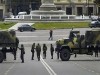 Georgian army truck picture. Military personnel patrol a street in central Tbilisi, November 8, 2007. A ring of soldiers cordoned off central Tbilisi on Thursday after Georgian President Mikhail Saakashvili declared a state of emergency and shut down independent media to quash six days of anti-government protests.