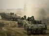 Isrraeli army Achzarit tracked armoured vehicle personnel carrier picture . Israeli soldiers ride in armored vehicles following an operation in the Gaza Strip near the Sufa Crossing between Israel and Gaza, Tuesday, Dec. 11, 2007. Israeli tanks and bulldozers backed by attack aircraft moved into the southern Gaza Strip on Tuesday, killing five militants in the widest operation in the territory since Islamic Hamas forces wrested control in June.