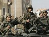 Lebanese Army soldiers picture . Lebanese soldiers sit on top of armoured personnel carriers near the parliament in downtown Beirut November 23, 2007. Lebanon's turmoil worsened on Friday with rival political camps failing to find a consensus that would allow parliament to choose a new head of state before pro-Syrian President Emile Lahoud's term expires at midnight. 